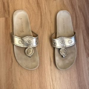 Gold Jack Rogers comfort sandals.